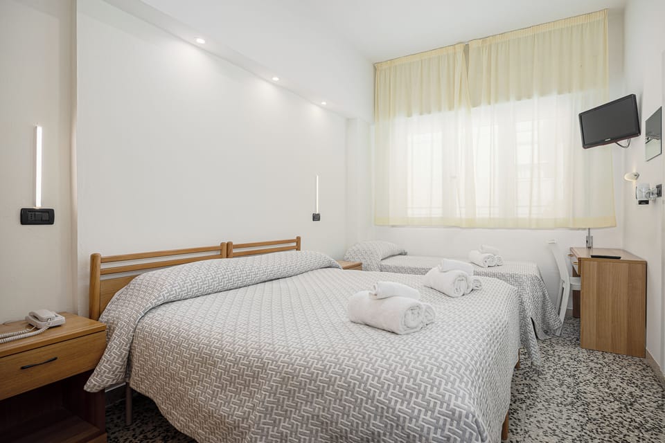 Standard Triple Room | Minibar, in-room safe, desk, free WiFi