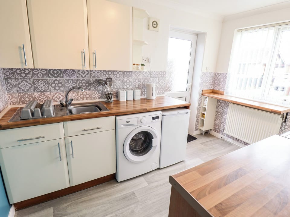 Fridge, electric kettle, toaster, cookware/dishes/utensils