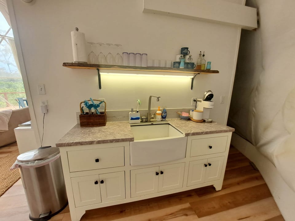 Fully equipped kitchenette with farmhouse sink and all the essentials for easy meals.