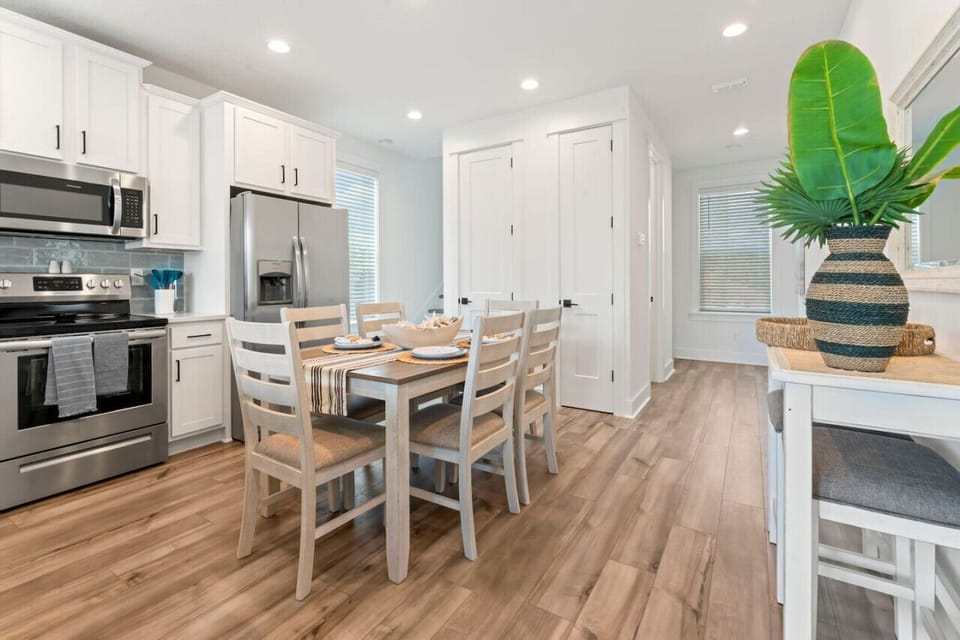 Bright and modern open kitchen with everything you need—new appliances, full cookware, and dual coffee options. Dine at the table or pull up a stool at the bar.