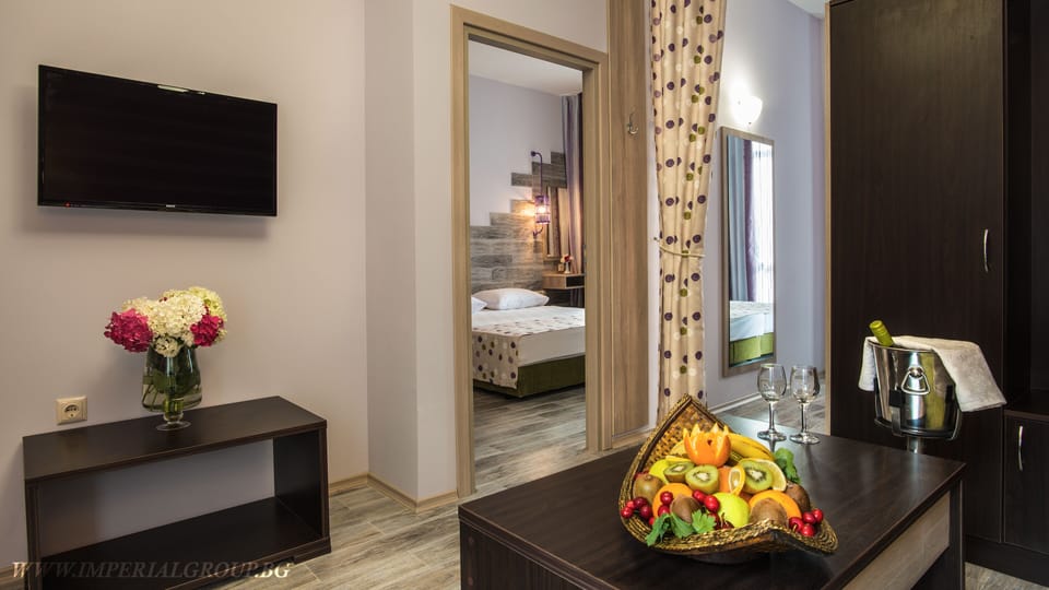 Family Two-Bedroom Suite (4 adults) | Living area | 32-inch flat-screen TV with cable channels, TV