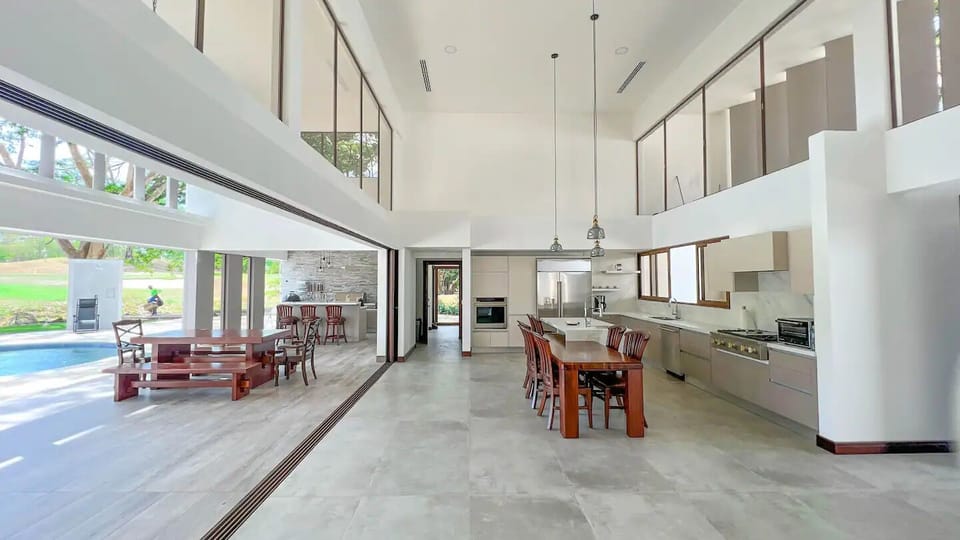 Step into a world of open-air luxury! Our spacious kitchen and living area seamlessly flow, extending to a grand terrace