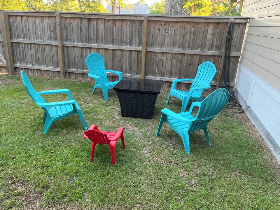 Backyard firepit and Adirondack chairs