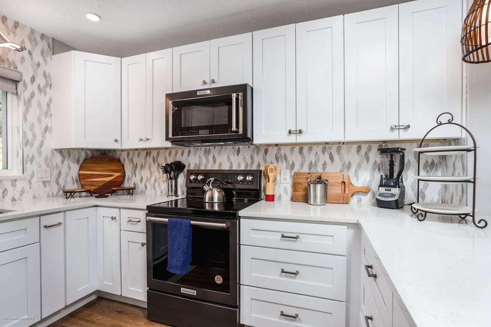 Gorgeously renovated, modern kitchen stocked with most everything one needs to create their favorite meal at home.