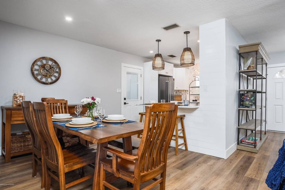 Solid wood Mission style dining table for 6 off the kitchen.  Sit together at mealtimes.