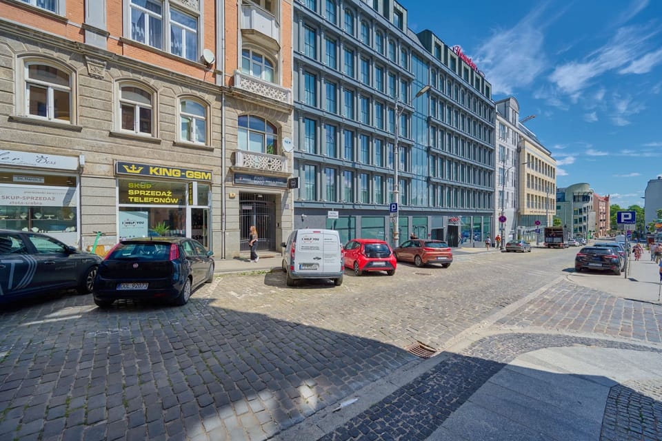 Another street view capturing the charming urban environment, complete with pedestrians and historic buildings.