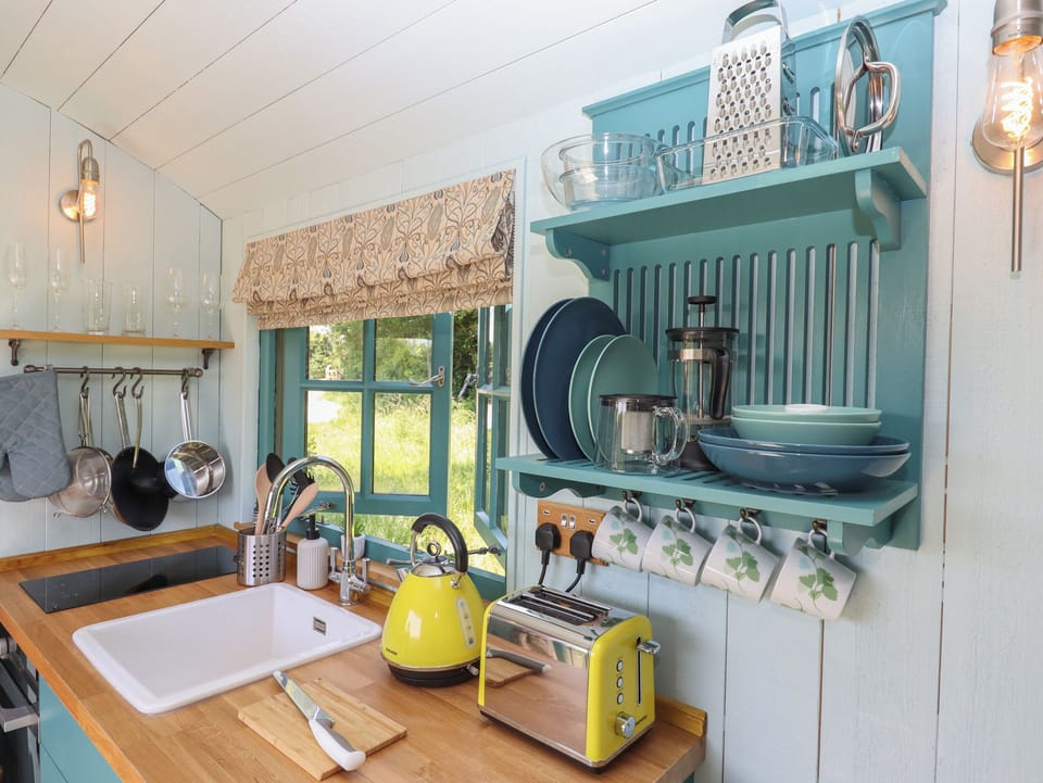 Fridge, electric kettle, toaster, cookware/dishes/utensils