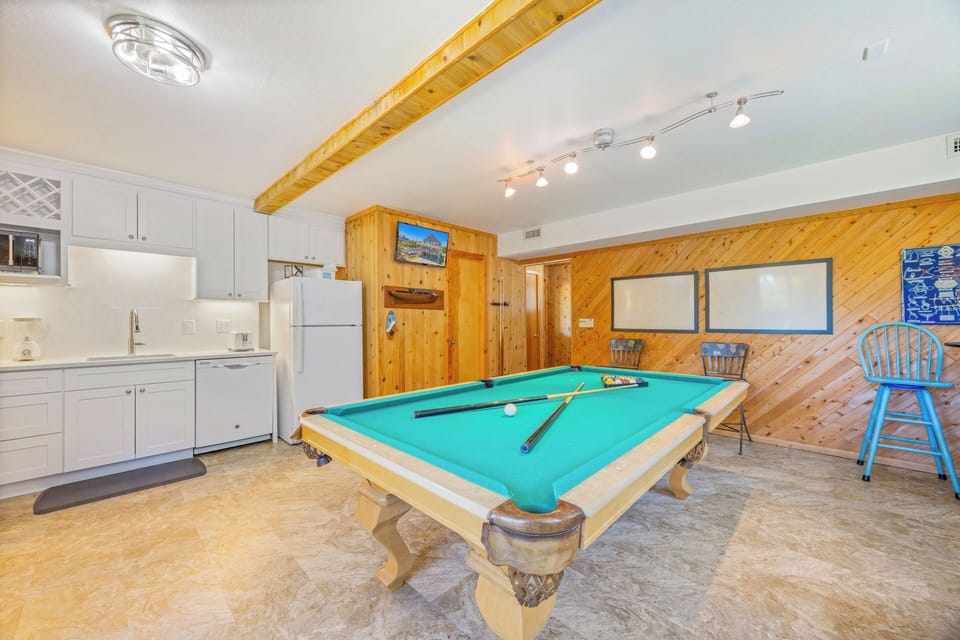 Your game room awaits with a full-size pool table, kitchenette, and cozy seating—perfect for friendly competition and relaxed evenings with friends and family.