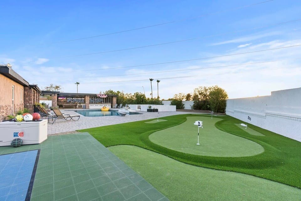 Your own mini-golf / putting green—practice your short game anytime, no tee time needed.