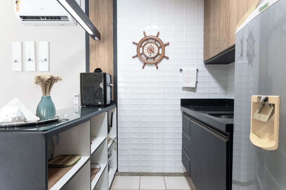 Basic Apartment | Private kitchen | Fridge, cookware/dishes/utensils, paper towels