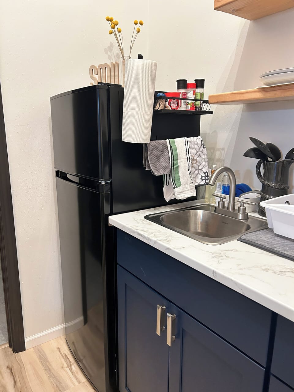 Apartment sized fridge, bar sink
