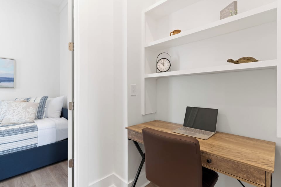 Office area with desk and twin day bed