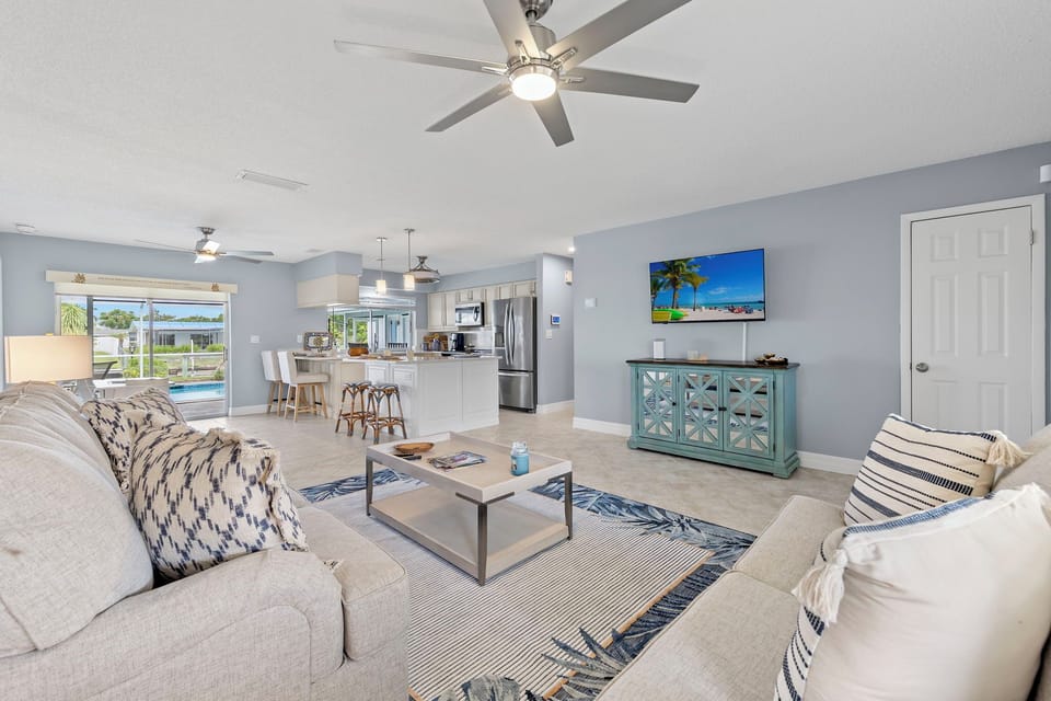The main living room offers comfortable seating (a sleeper sofa) & a flat-screen TV