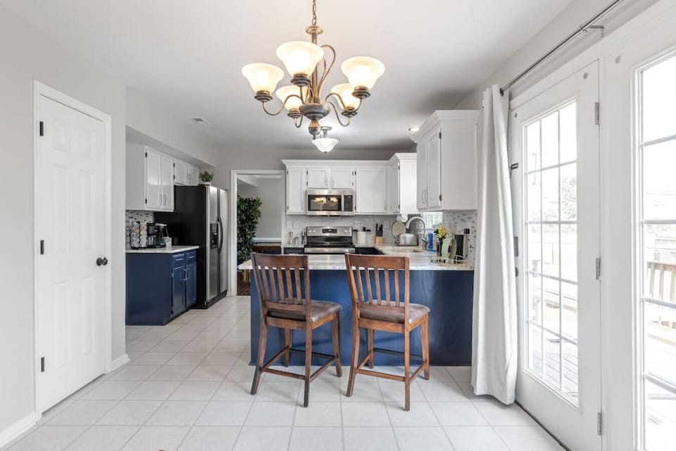 Additional seating and French door access to the backyard make this kitchen the heart of the home.