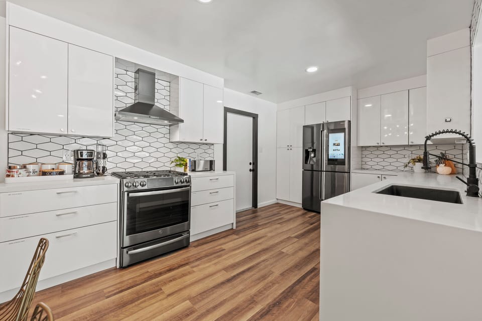 Bright, open kitchen with modern appliances and plenty of workspace
