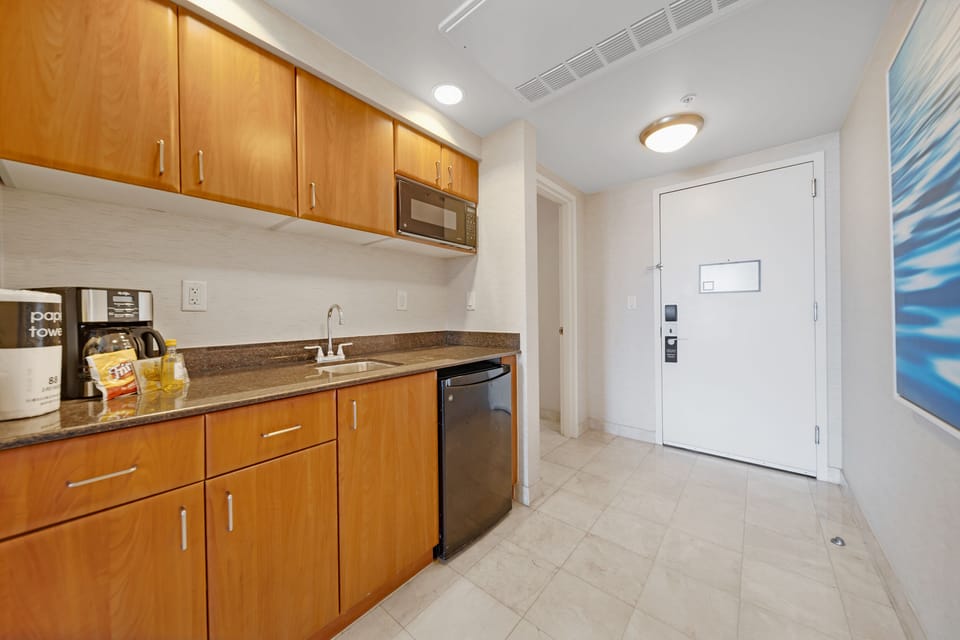 The kitchenette has a coffee machine, a microwave and a small refrigerator 