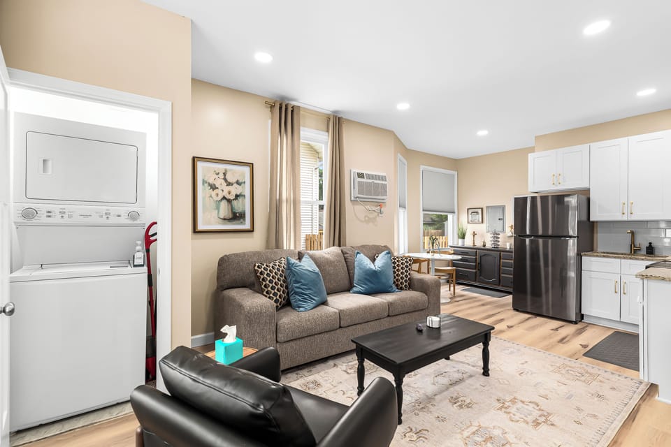 Relax in our inviting living room furnished with cozy seating and a smart TV for your entertainment.