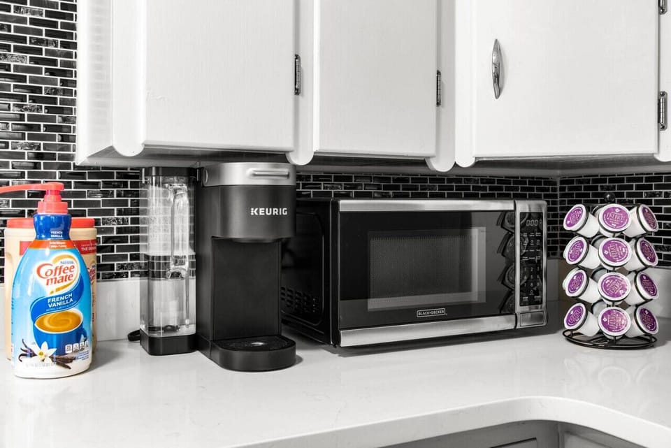 Step into our kitchen and immerse yourself in a coffee lover`s paradise. Brew your perfect cup and savor the aroma as you start your day with warmth and comfort. Discover more at Blessedbnbs.net.