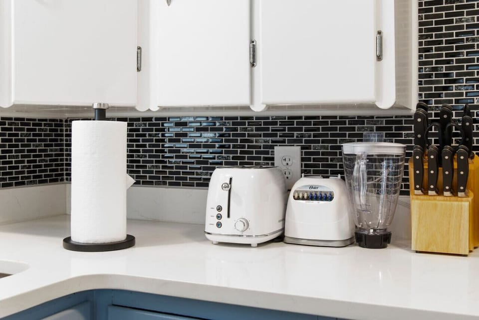 Discover culinary bliss with a kitchen ready for your every need. From toasting to blending, our toaster, blender, and knife set are waiting for your next delicious creation. Discover more at Blessedbnbs.net.