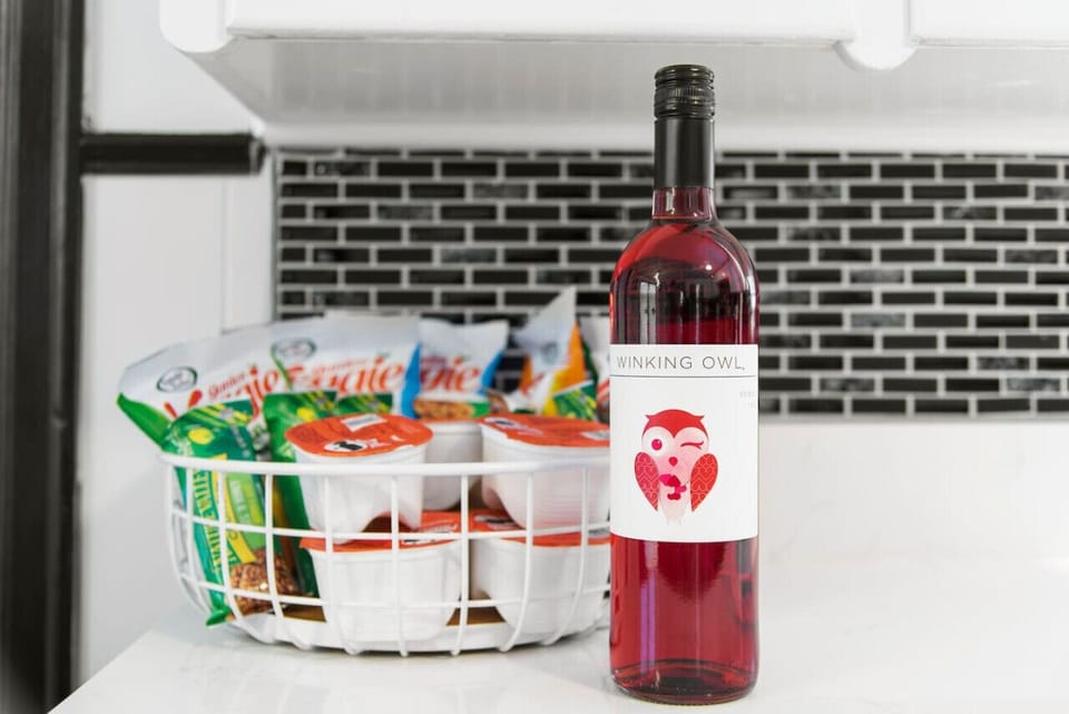 Indulge in the perfect welcome with a complimentary bottle of wine and snacks in our fully equipped kitchen. Relax, unwind, and toast to unforgettable moments. Discover more at Blessedbnbs.net.