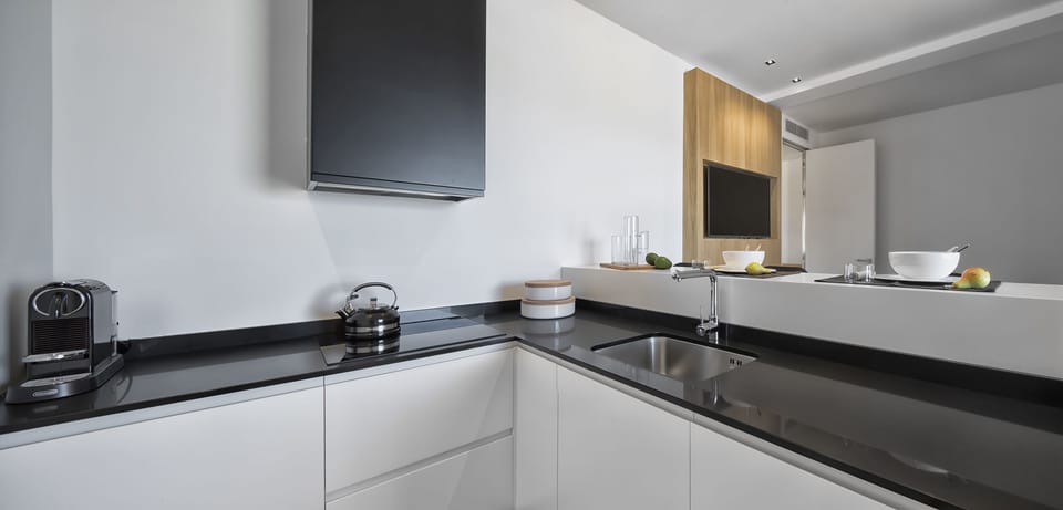 Panoramic Condo | Private kitchen | Mini-fridge, microwave (on request), stovetop, dishwasher