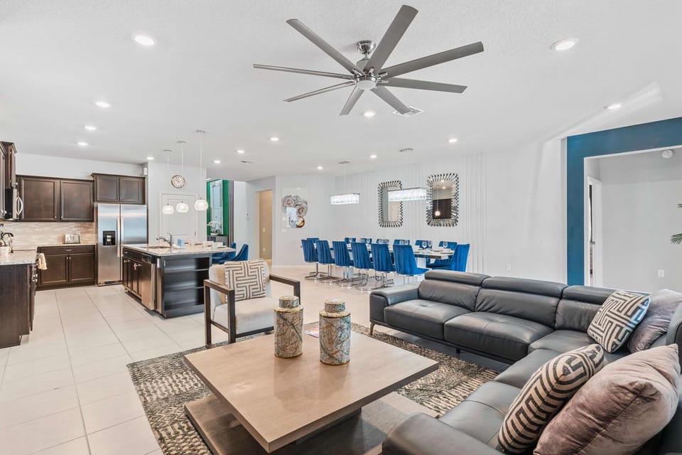 The living area, conveniently positioned near the kitchen  fosters a seamless connection between relaxation and culinary delights.