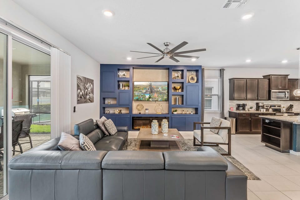 The living area boasts an elegant TV setup, adding a touch of sophistication to the space. A refined ambiance where entertainment meets style, promising moments of relaxation and luxury.