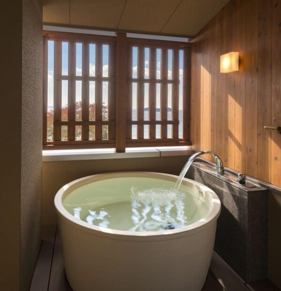Corner Suite, Semi Open-air Bath | Deep soaking bathtub