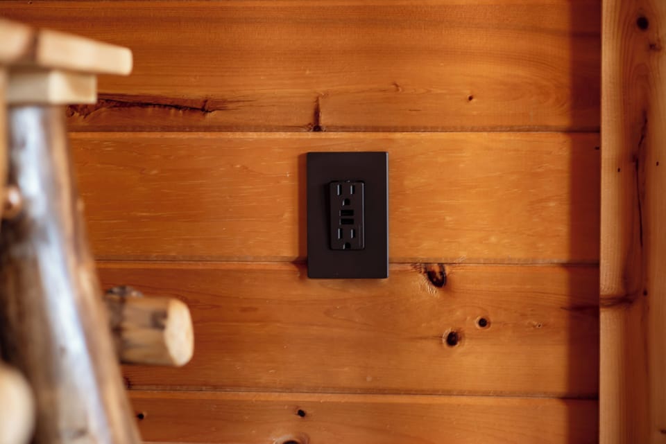 4 USB ports; 1 in each bedroom, living room and loft. Look for the bronze plates