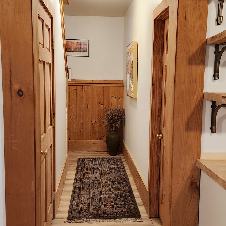 Hall from upper to ground level, washer/dryer utility room (left), BR#3 to right