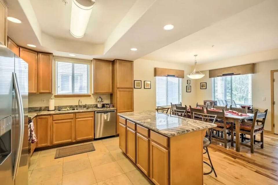 open kitchen with counter that seats 3