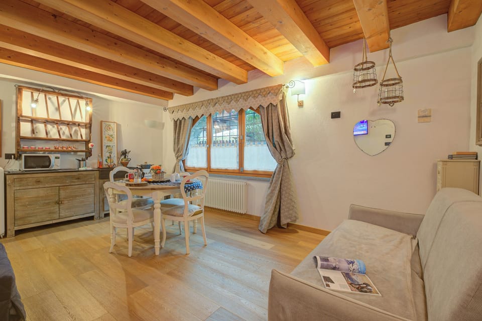 Family Studio (Cozy Nest In Bardonecchia) | Living area | 21-inch Smart TV with cable channels