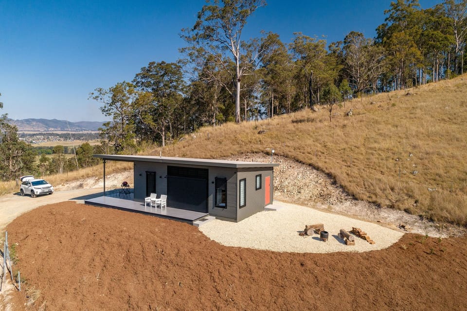 Set high among the trees The Bellbird Eco-Cabin has an outdoor fire area