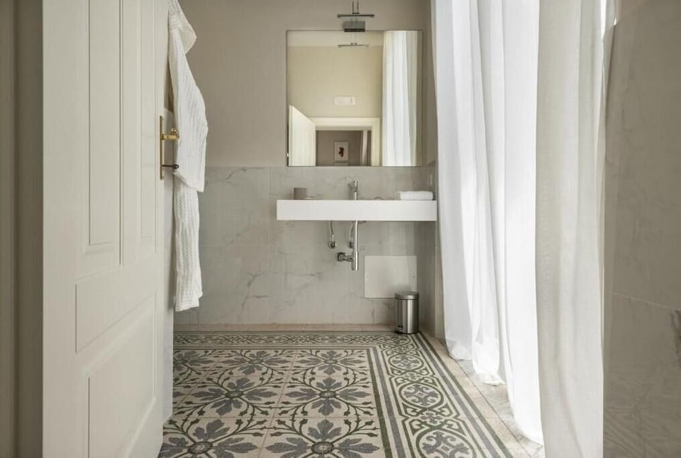 Deluxe Room | Bathroom | Shower, rainfall showerhead, hair dryer, bathrobes