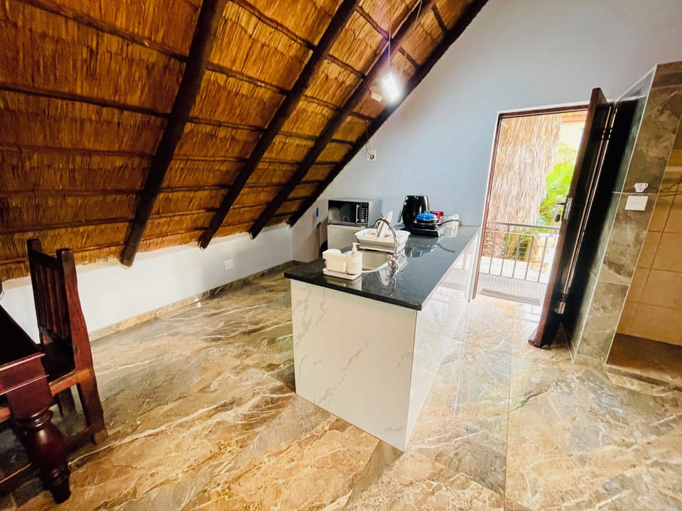 Luxury Double Room | Private kitchenette | Microwave, coffee/tea maker, electric kettle, dining tables