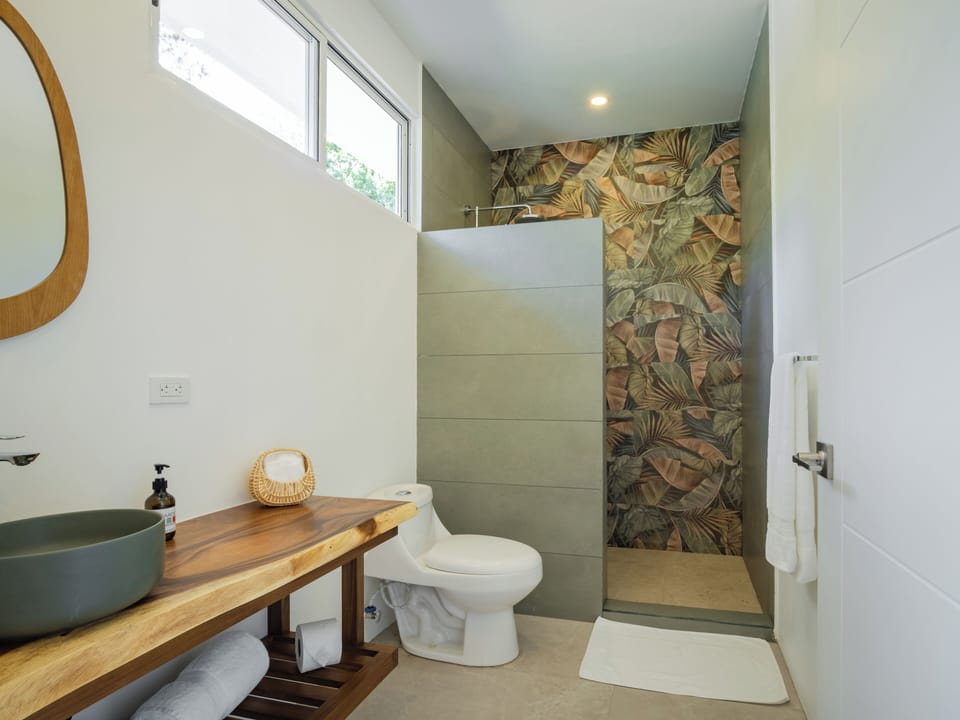 Designer toiletries, hair dryer, towels, soap
