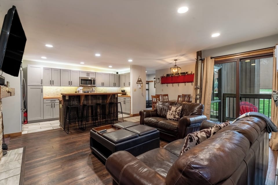 Sink into luxurious leather seating in this spacious open-concept retreat, where your fully-equipped kitchen invites memorable meals together.