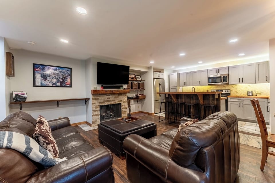 Sink into rich leather seating by your stone fireplace while your gourmet kitchen awaits your culinary adventures.
