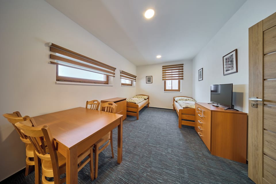 Family Apartment | 1 bedroom, blackout drapes, cribs (free), WiFi (free)