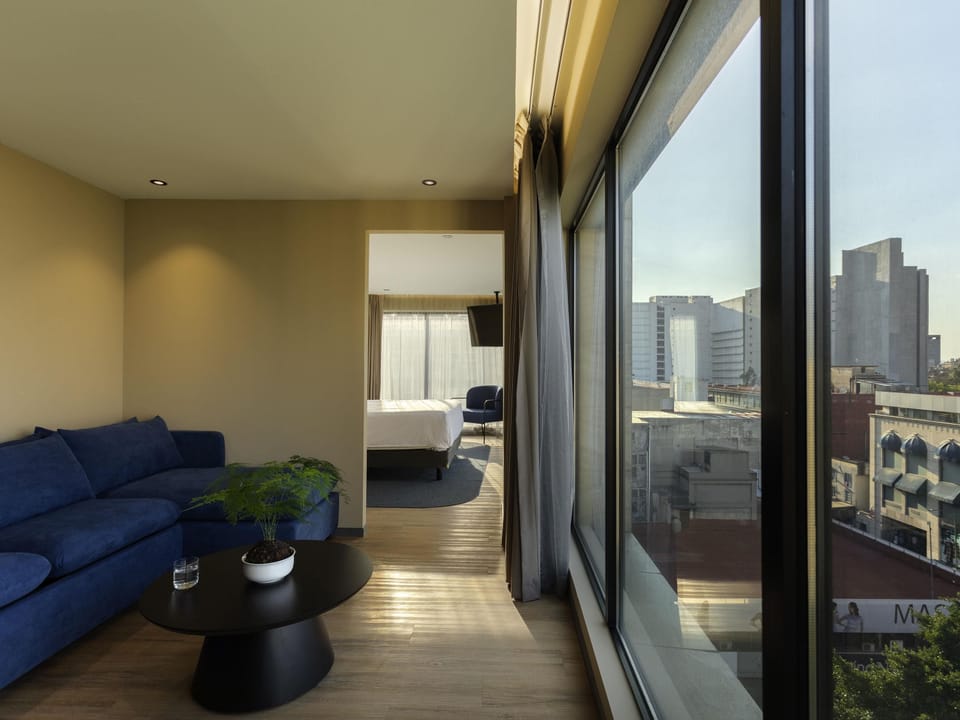 Executive Suite, 1 King Bed with Sofa bed | In-room safe, blackout drapes, iron/ironing board