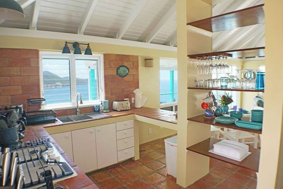 Your kitchen looks into the living & dining area as well as out to Reef Bay