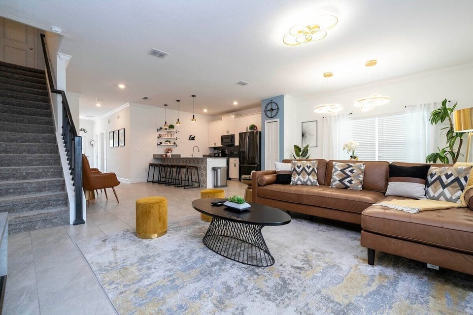 Open living space that seamlessly connects the beautiful kitchen and dining area, offering a perfect blend of comfort and style.