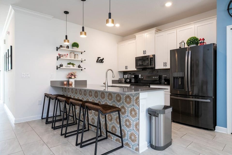 Step into this stunning, vibrant kitchen oasis, where beauty meets functionality. With its spacious layout and ample counter space, meal prep becomes a joyous experience. Perfect for gatherings or quiet moments, this kitchen beckons travelers seeking the ultimate vacation retreat.