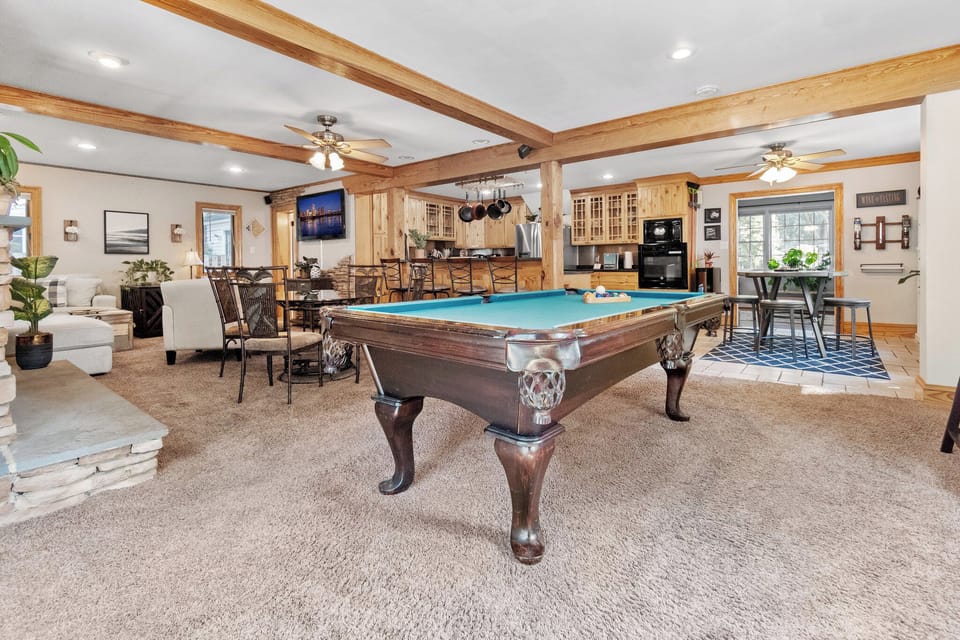Game Room: Unwind with a classic pool table and cozy dining space for laughter and fun!