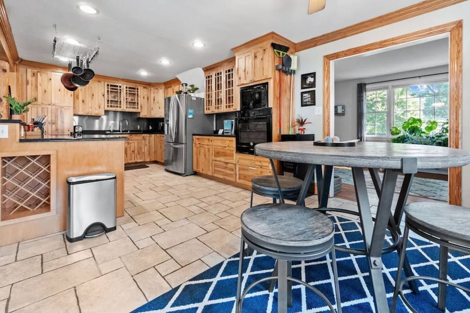 Spacious Kitchen: Whip up culinary delights in a warm wood-accented space with modern appliances!
