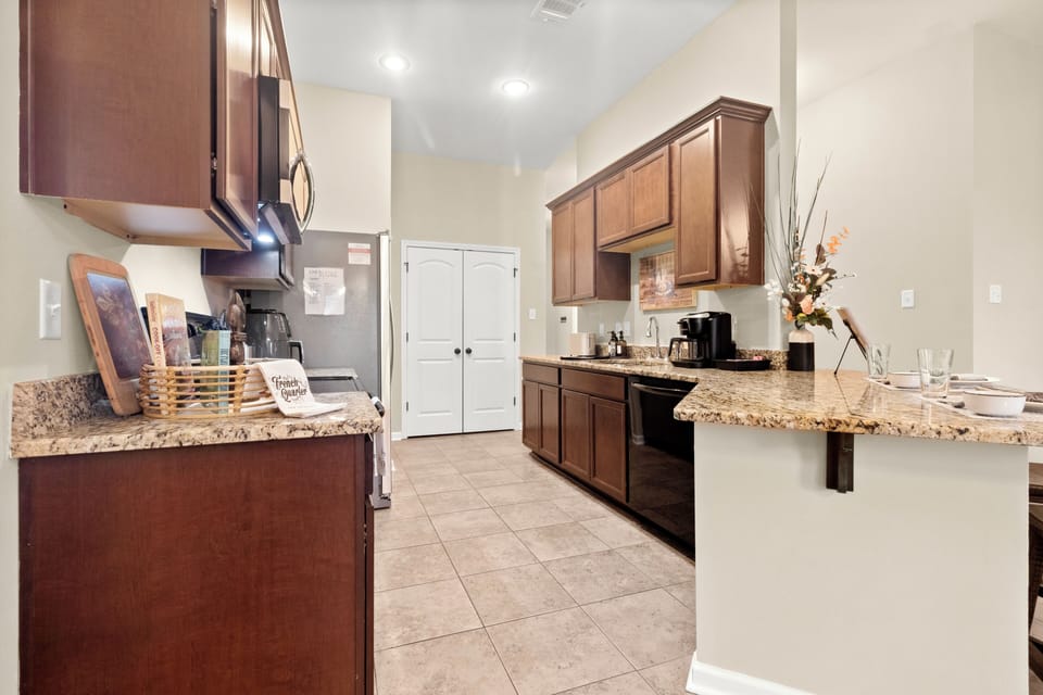 Cook up a storm in the fully equipped kitchen at Calvin's Corner. Enjoy king beds, master bathroom, and more at 1919 Calvin Court.