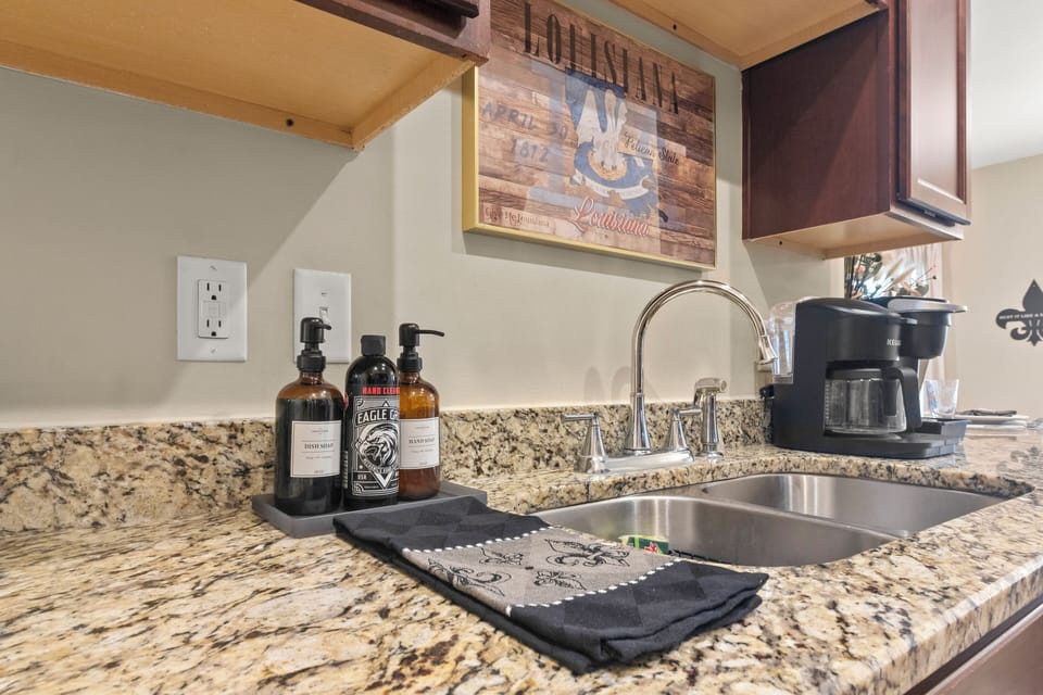 Cook up a storm in the fully equipped kitchen at Calvin's Corner. Enjoy king beds, master bathroom, and more at 1919 Calvin Court.