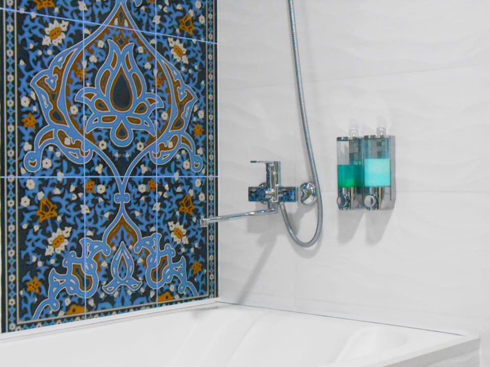 Deluxe Double or Twin Room | Bathroom | Hair dryer, slippers, towels