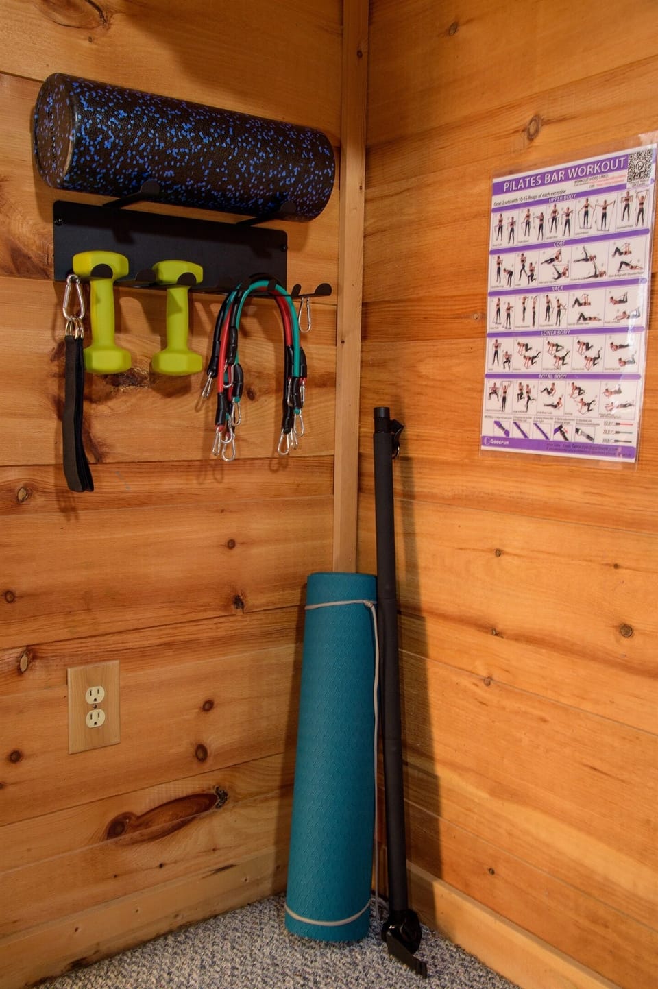 Pilates bar, weights, and band workout set.