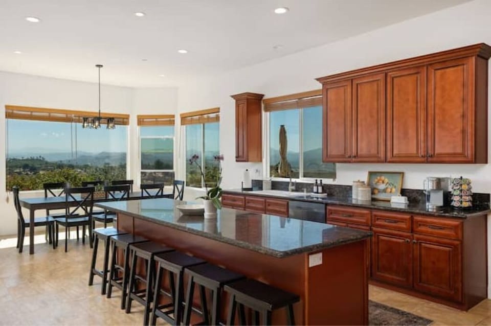 Dining room and kitchen comfortably seat 14 guests. A highchair is available.